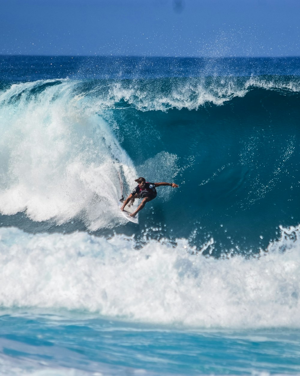 Surfer deep inside a barrel